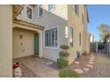 House entryway with a green door and stone pathway at 734 Holland Heights Ave, Las Vegas, NV 89123