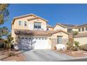 Two-story house with a white garage door and landscaping at 734 Holland Heights Ave, Las Vegas, NV 89123