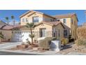 Two-story house with a white garage door and landscaping at 734 Holland Heights Ave, Las Vegas, NV 89123