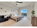 Spacious main bedroom with plush carpet and private access to balcony at 8255 One Las Vegas Blvd # 504, Las Vegas, NV 89123