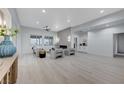 Bright, open living room featuring modern furnishings, a sleek fireplace, and abundant natural light at 11119 Cantoria Ct, Las Vegas, NV 89141