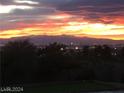 Stunning sunset view overlooking city lights and mountain range at 248 N Milan St, Henderson, NV 89015