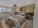 Spacious bedroom with large windows and wood accent wall at 2867 Geary Pl # 3008, Las Vegas, NV 89109