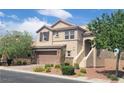 Beautiful two-story home with stone accents, a two-car garage, mature trees, and desert-friendly landscaping at 7914 Torreys Peak St, Las Vegas, NV 89166