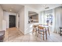 Bright dining area with kitchen view and modern table set at 9157 Chenille Ct, Las Vegas, NV 89149