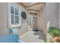 Front entry with a decorative security door and sidelights at 1774 Franklin Chase Ter, Henderson, NV 89012