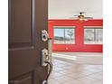 Open entryway with red walls and tile flooring at 3455 Halter Dr, Las Vegas, NV 89122