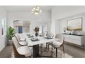 Elegant dining room with a marble table and modern chairs at 6521 Macdoogle St, Las Vegas, NV 89166