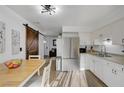 Open kitchen concept with stainless steel appliances and adjacent living area at 155 E Van Wagenen St, Henderson, NV 89015