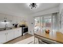 Cozy kitchen area with stainless steel appliances and a sliding door to backyard patio at 155 E Van Wagenen St, Henderson, NV 89015