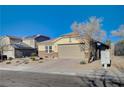 Single-story home with attached garage and desert landscaping at 2452 Blair Castle St, Henderson, NV 89044