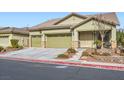 Two-story house with a two car garage and desert landscaping at 4062 Narada Falls Ave, North Las Vegas, NV 89085