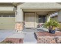 Inviting front porch with decorative double doors and sitting area at 4062 Narada Falls Ave, North Las Vegas, NV 89085