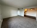 Spacious living room with neutral carpeting and an open floor plan at 585 S Royal Crest Cir # 21, Las Vegas, NV 89169