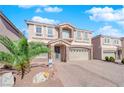 Two-story house with stone accents and a three-car garage at 6360 Stag Hollow Ct, Las Vegas, NV 89139