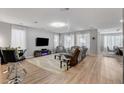 Spacious living room with lots of natural light and entertainment center at 2395 Dalewood Ave, North Las Vegas, NV 89086