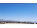 Scenic view of the city skyline with distant mountains against a clear blue sky at 2904 Bow Bridge Dr, Las Vegas, NV 89134