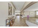 Bright and spacious entryway with tile flooring and decorative accents at 3906 Jacob Lake Cir, Las Vegas, NV 89118