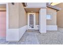 Front door with a decorative screen and a stone walkway at 7053 Solana Ridge Dr, North Las Vegas, NV 89084