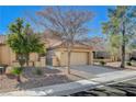 Charming single-story home featuring a tile roof, well-maintained landscaping, and a two-car attached garage at 8805 Litchfield Ave, Las Vegas, NV 89134