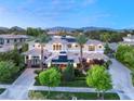 Luxury home with solar panels, mountain views, and beautifully landscaped grounds at 10308 Rocky Mesa Ct, Las Vegas, NV 89144