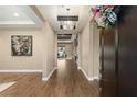 Elegant entryway with hardwood floors and a view to the living room at 12456 Edinburgh Cask Ave, Las Vegas, NV 89138