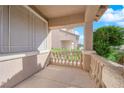 Covered porch with railing offering a view of the neighborhood at 1326 Summer Dawn Ave, Henderson, NV 89014