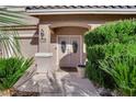 Front entrance with double doors, landscaping, and house number at 1326 Summer Dawn Ave, Henderson, NV 89014