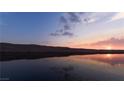 Scenic sunset view over calm lake water at 1485 Placid Coast Ct, Henderson, NV 89011