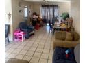 Living room with tiled floors and casual furniture at 1924 Hart Ave, North Las Vegas, NV 89032