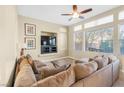 Gathering room with a large sectional sofa and built-in entertainment center at 1932 Barrow Glen Ct, North Las Vegas, NV 89084