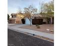 House exterior showcasing a two-car garage and well-maintained landscaping at 2108 Buckeye Reef St, Henderson, NV 89002