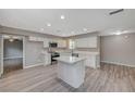 Modern kitchen with white cabinets, stainless steel appliances, and an island at 3834 S Sandhill Rd, Las Vegas, NV 89121