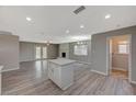 Open concept kitchen with island and stainless steel appliances at 3834 S Sandhill Rd, Las Vegas, NV 89121