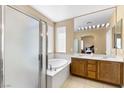 Large bathroom with double sinks, a soaking tub and shower at 7348 Zion Falls St, Las Vegas, NV 89131