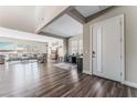 Bright entryway with hardwood floors and views into living room at 8990 Rolling Pietra St, Las Vegas, NV 89166