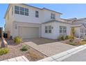 Well maintained two story home with a two car garage and clean landscaping at 8990 Rolling Pietra St, Las Vegas, NV 89166