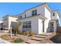 Inviting two-story home featuring modern architecture and low maintenance landscaping at 8990 Rolling Pietra St, Las Vegas, NV 89166