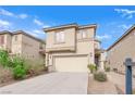 Two-story house with a beige facade and attached garage at 10646 Shifting Breeze Ave, Las Vegas, NV 89129