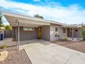 Mid-century modern home with carport and desert landscaping at 1709 S 6Th St, Las Vegas, NV 89104