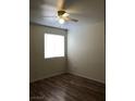 This bedroom features wood-look floors and a window that lets in ample natural light at 2725 S Nellis Blvd # 1201, Las Vegas, NV 89121