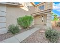 Landscaped walkway leading to the front entrance of the home at 7640 Ribbon Garland Ct, Las Vegas, NV 89139