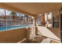 Covered patio overlooking the community pool at 1013 Falconhead Ln # 101, Las Vegas, NV 89128