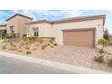 Single-story home with attached garage and landscaped front yard at 10262 Super Jovian St, Las Vegas, NV 89143