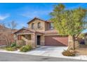 Two-story house with brown accents and landscaping at 10597 Painted Bridge St, Las Vegas, NV 89179