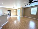 Living room with hardwood floors, sliding doors to patio at 1350 Crystal Hill Ln # 3, Henderson, NV 89012