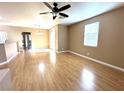 Spacious living room featuring hardwood floors and a ceiling fan at 1350 Crystal Hill Ln # 3, Henderson, NV 89012