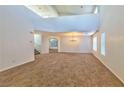 Spacious living room featuring high ceilings and a chandelier at 1605 Calle Montery St, Las Vegas, NV 89117