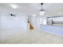 Spacious dining area with tile flooring and a chandelier at 2120 Waterlily View St, Henderson, NV 89044