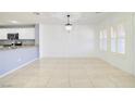 Bright dining room with tile floor and large windows at 2120 Waterlily View St, Henderson, NV 89044